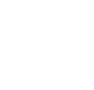 icon of a person working at a computer at a desk